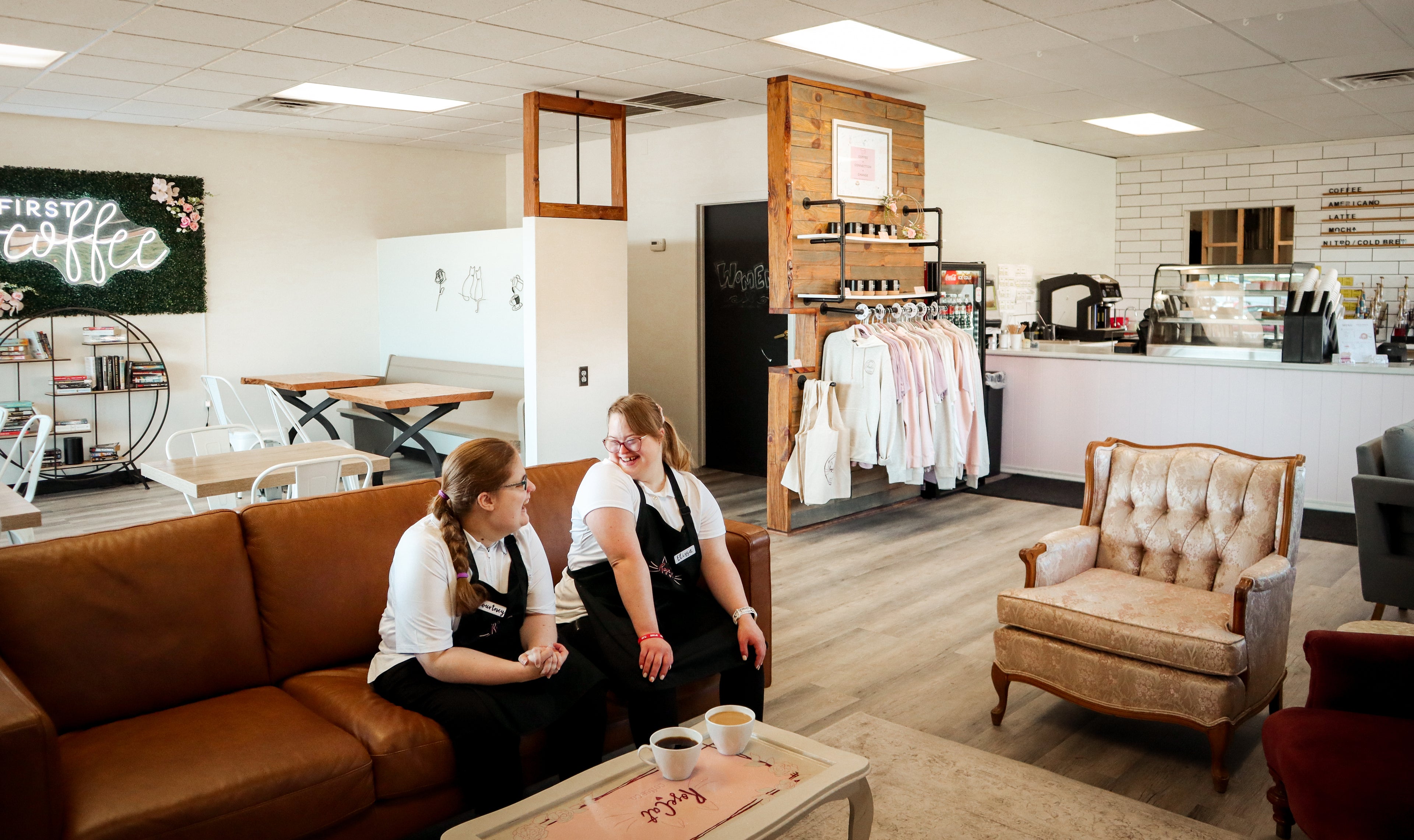 Rose Cat Baristas Elissa and Courtney hang out at the shop, showing off the comfortable and inviting environment. 