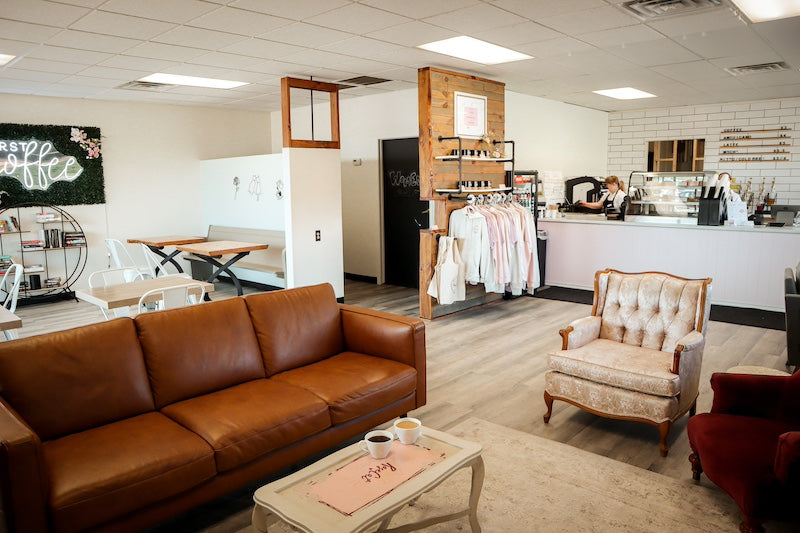 Wide Lens view of Rose Cat Coffee Co in Lincoln Nebraska featuring comfortable seating and cute decor. 