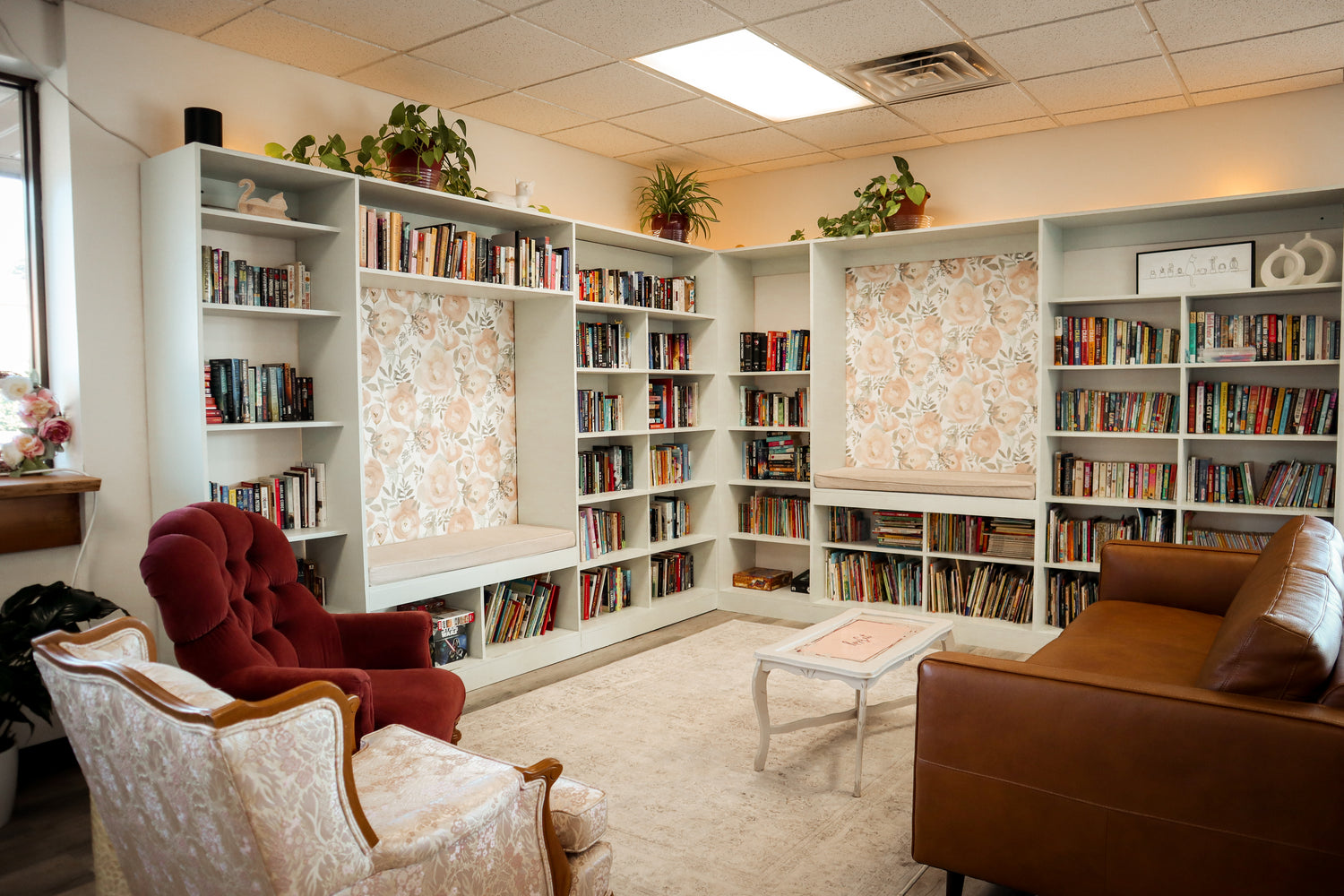 Wide Lens view of Rose Cat's comfortable seating area and take-and-leave library.